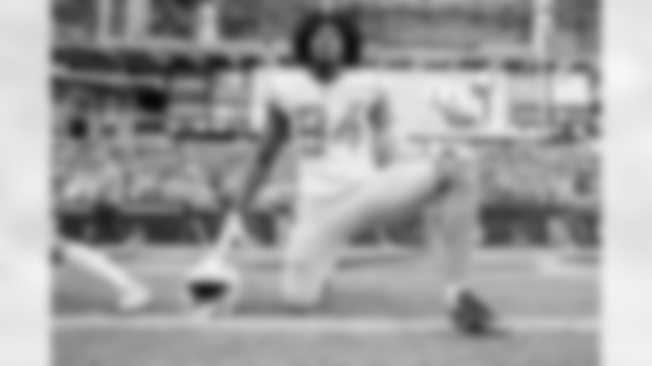 The Los Angeles Chargers prepare to play against the Arizona Cardinals at State Farm Stadium on November 27, 2022 in Glendale, Arizona.