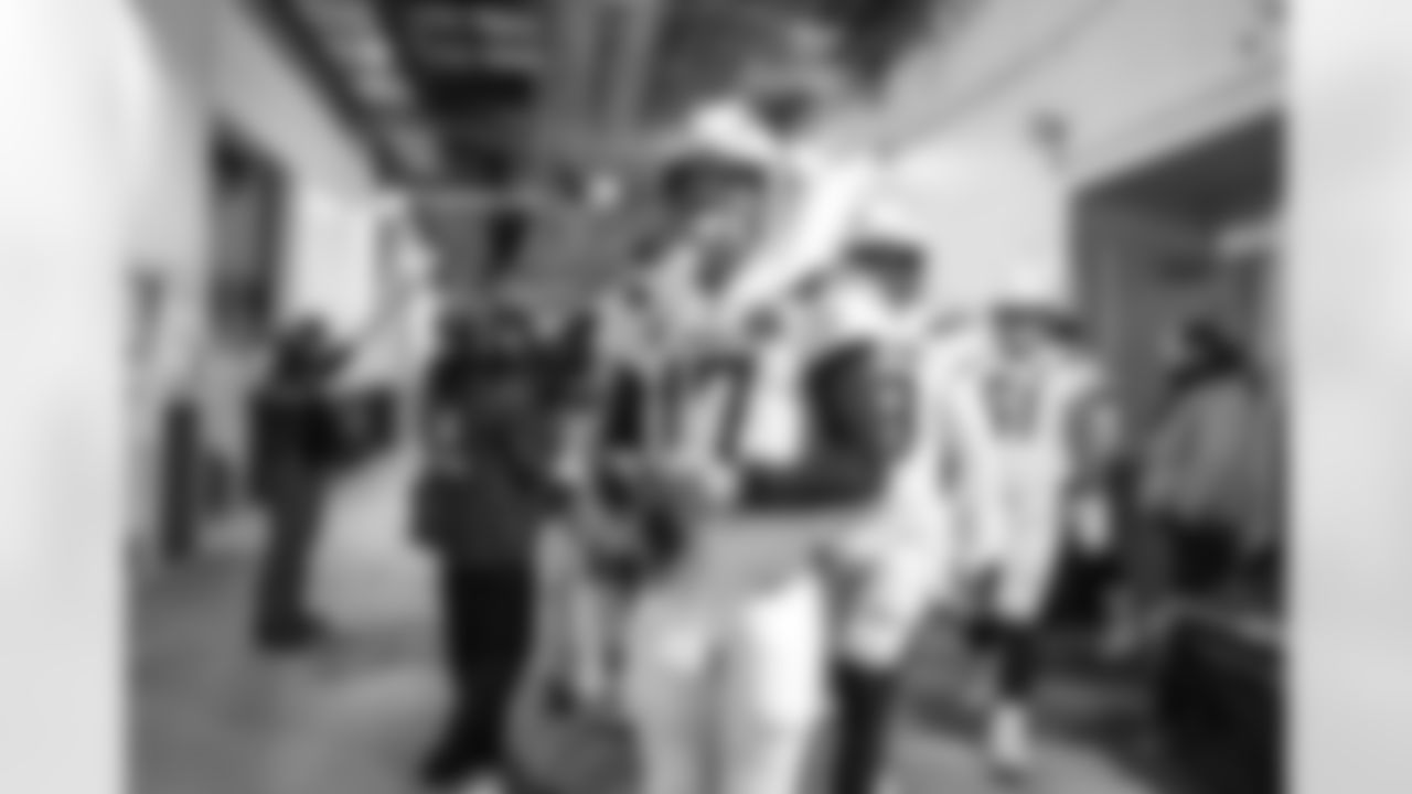 Philip Rivers walks out to the field before the Divisional Round matchup against the New England Patriots at Gillette Stadium.