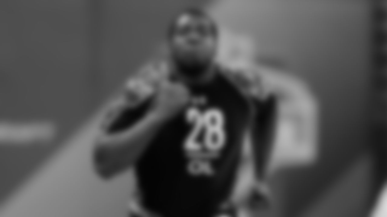 Russell Okung runs the 40-yard dash at the NFL Scouting Combine.