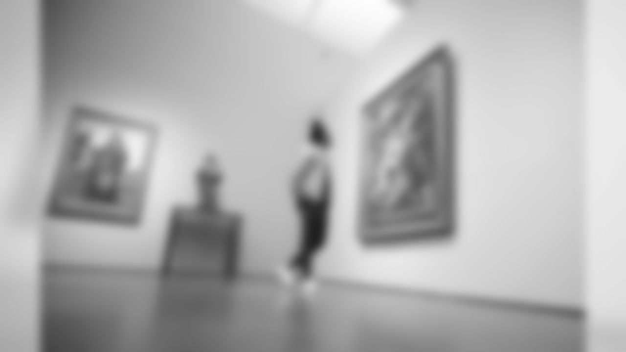 LA Chargers CB Michael Davis observes a painting from the LACMA exhibition, "To Rome and Back: Individualism and Authority in Art, 1500-1800." The collection focuses on the depth of Rome's impact from the Renaissance to the Enlightenment.