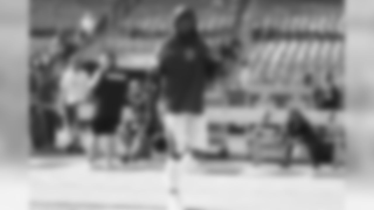 Jatavis Brown walks onto the field to warm up at Oakland-Alameda County Coliseum before the Week 10 matchup against the Oakland Raiders.