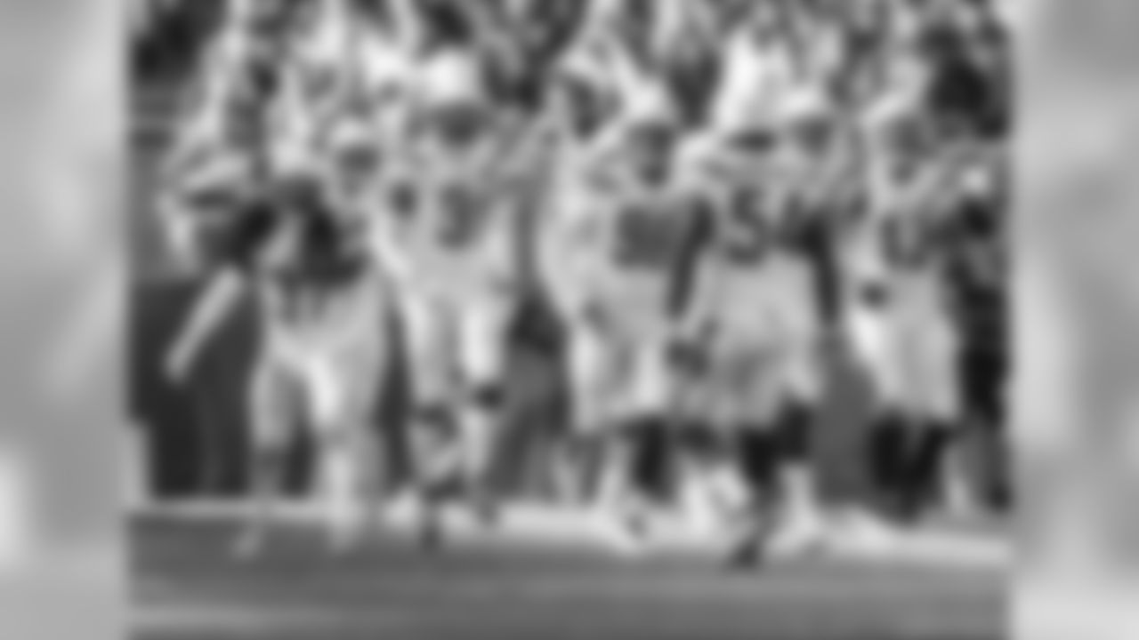 Defense celebrates on the field during the Wild Card matchup against the Baltimore Ravens at M&T Bank Stadium.