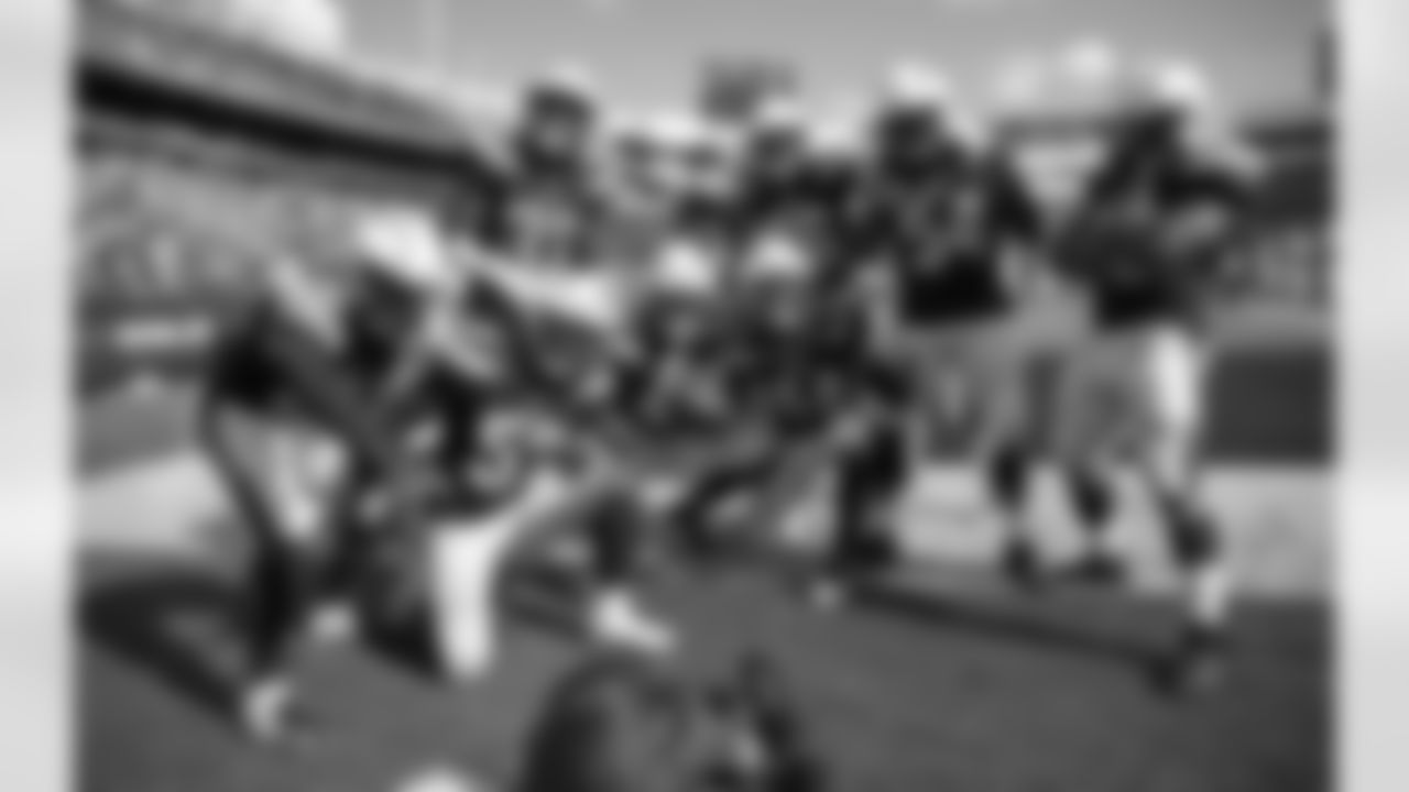 The Bolts celebrate Kyzir White's first NFL interception during the Chargers' Week 2 game against the Buffalo Bills at New Era Field.