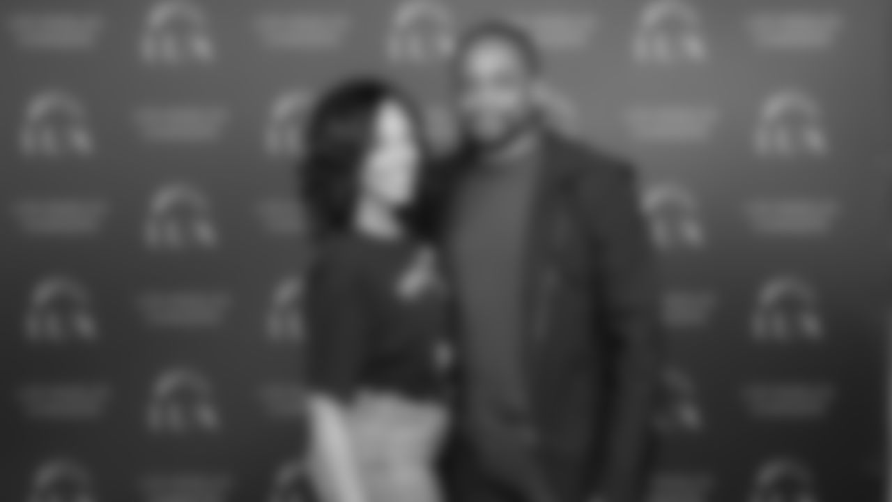 Jazmyn Simon and Dule Hill pose for a photo at the Chargers LUX launch party.
