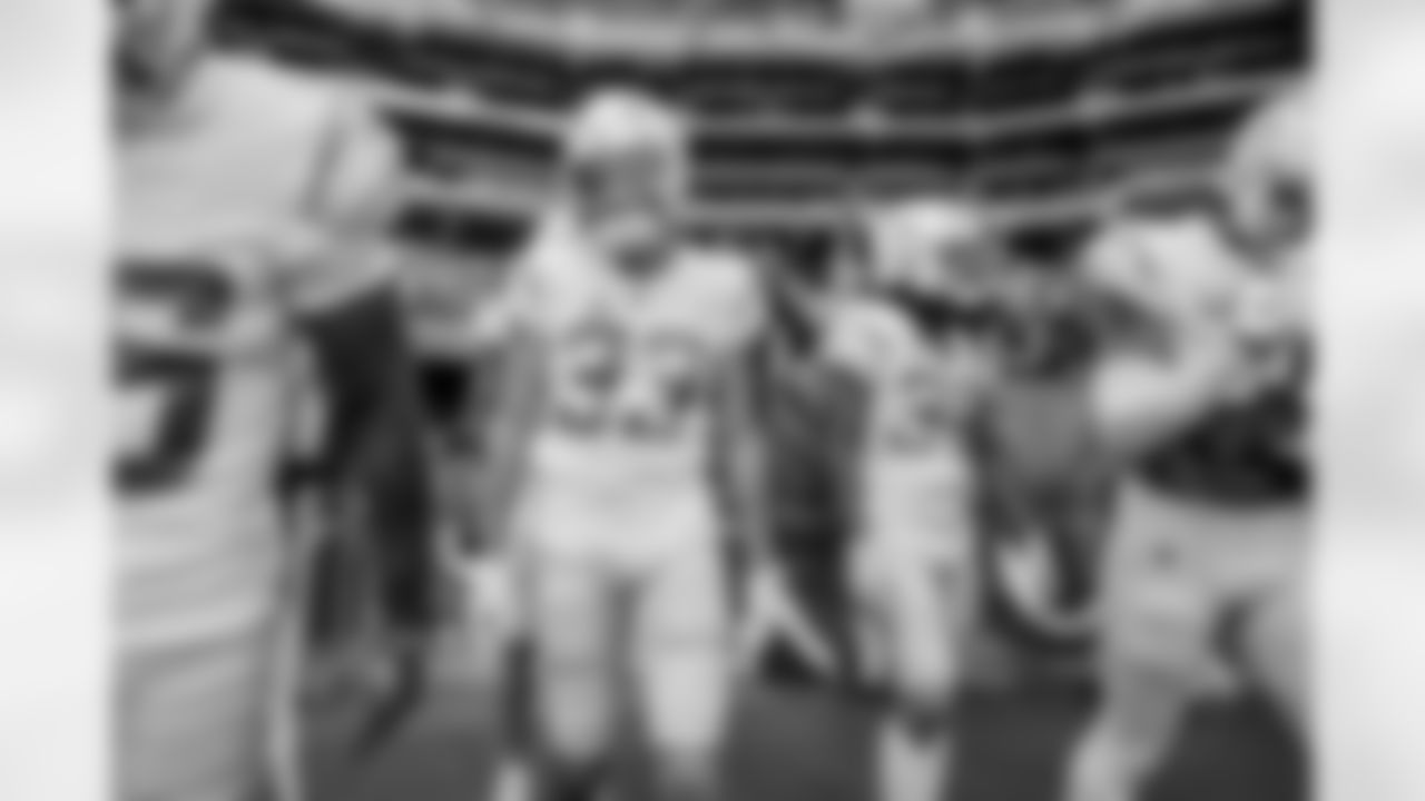 The Los Angeles Chargers prepare to play against the Arizona Cardinals at State Farm Stadium on November 27, 2022 in Glendale, Arizona.