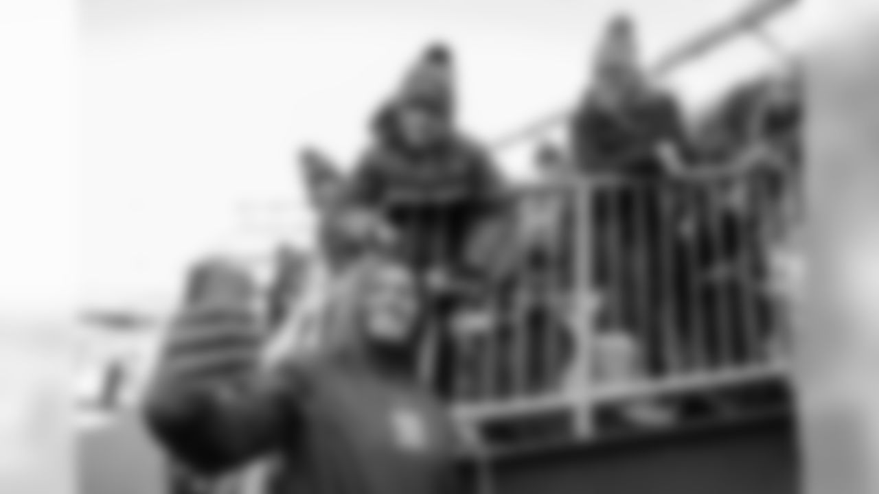 Isaac Rochell takes a selfie with a fan before the Divisional Round matchup against the New England Patriots at Gillette Stadium.