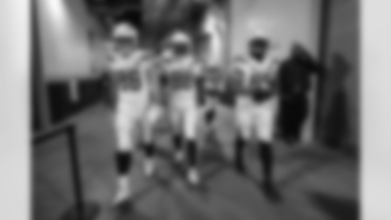 Hunter Henry, Virgil Green and Antonio Gates walk out to the field before the Divisional Round matchup against the New England Patriots at Gillette Stadium.