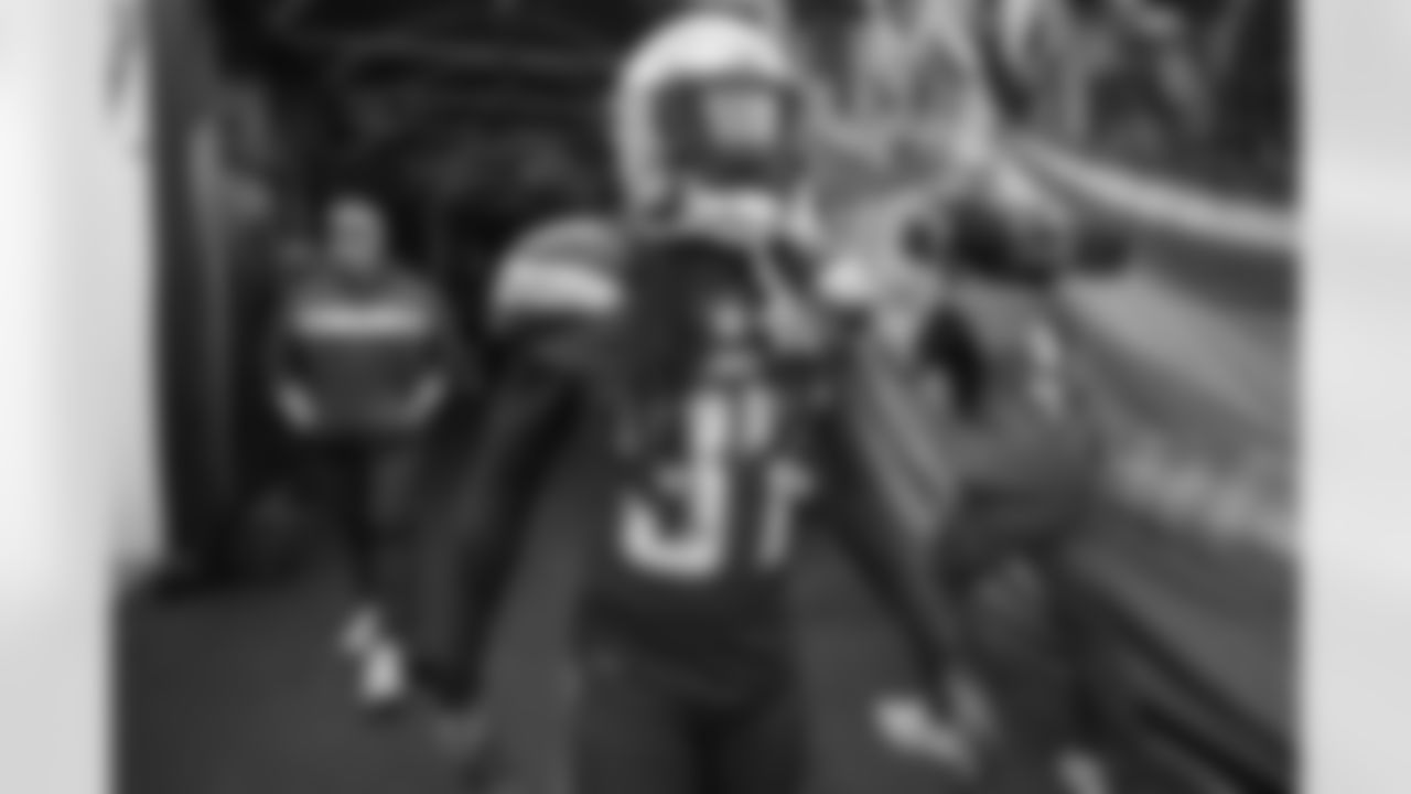 Jahleel Addae walks out to the field to warm up before the Week 14 matchup against the Cincinnati Bengals at ROKiT Field at StubHub Center.