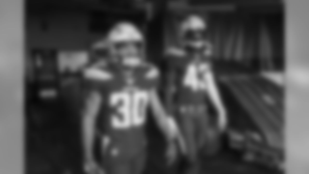Austin Ekeler and Michael Davis walk out to the field at FirstEnergy Stadium before the Bolts take on the Browns.