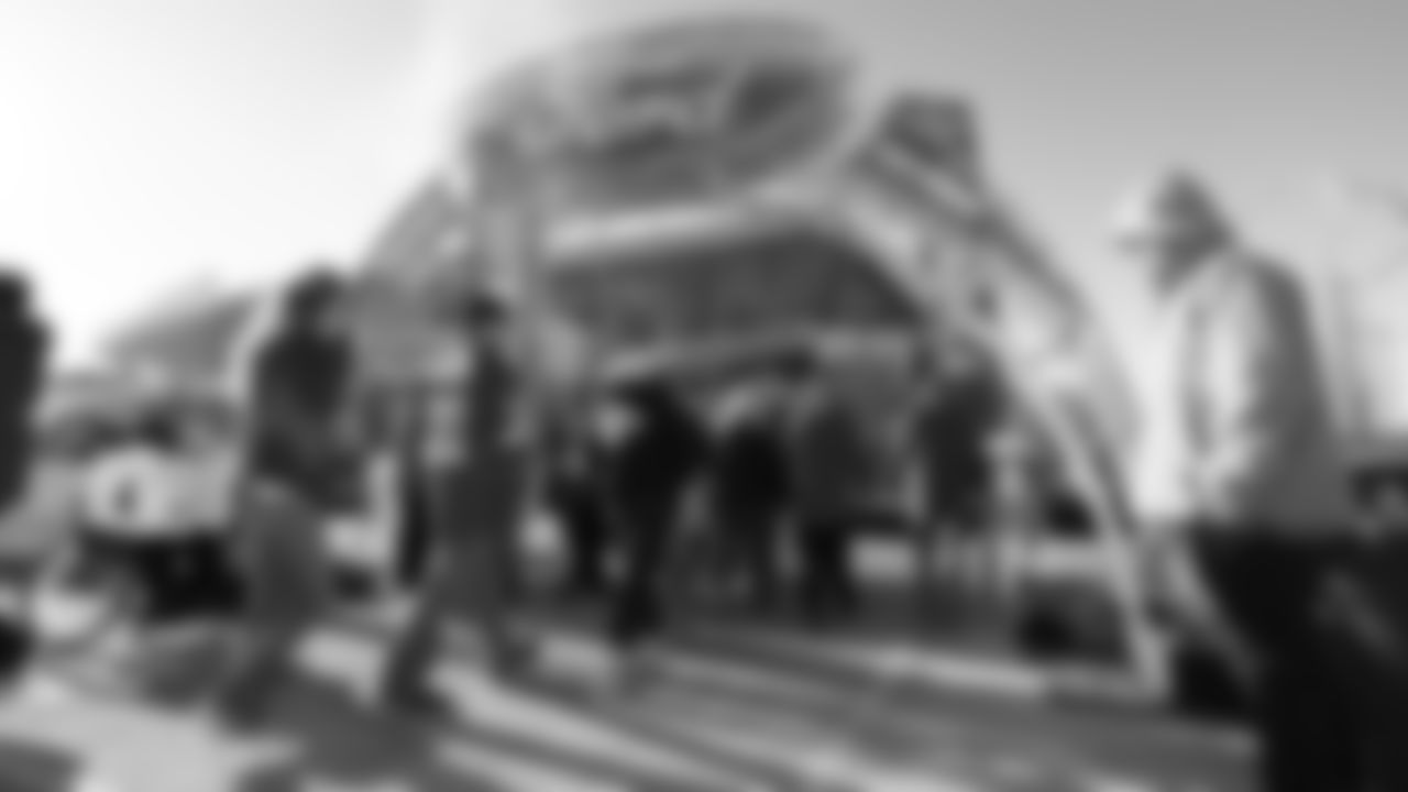 Fan leave and enter the Ford Tailgate District prior to an NFL football game against the Las Vegas Raiders, Sunday, December 12, 2021 in Kansas City.