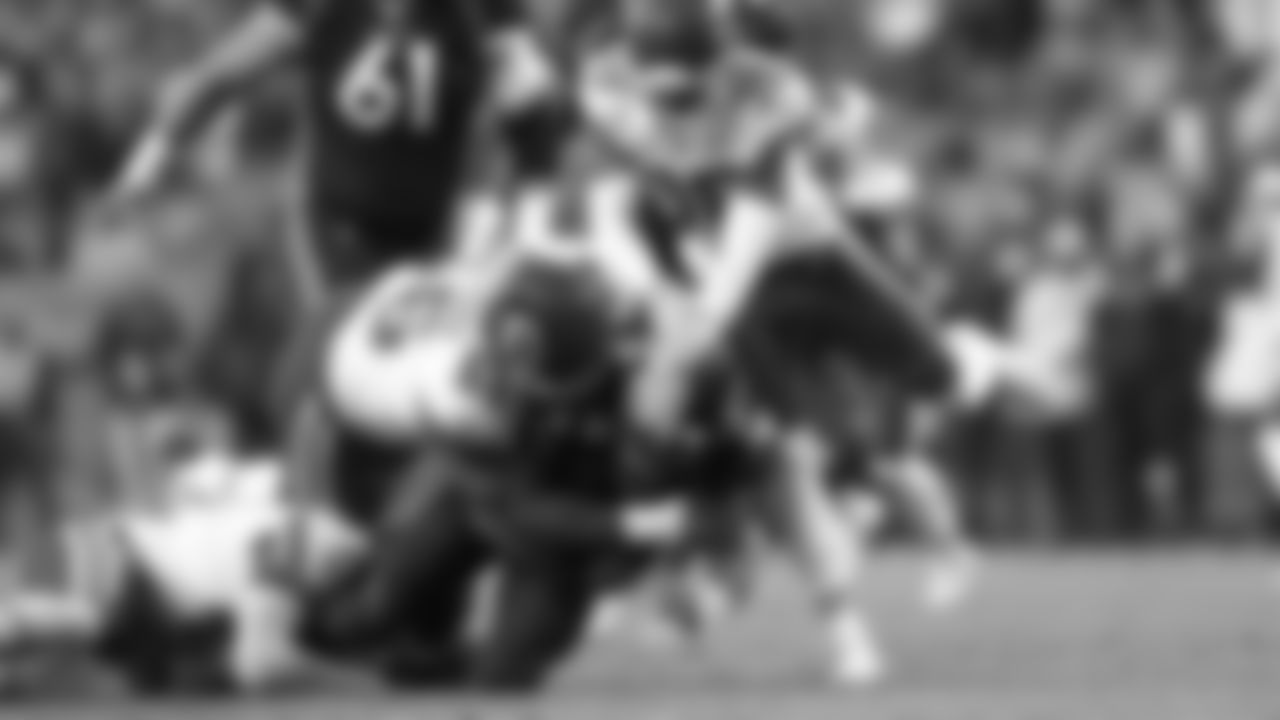 Kansas City Chiefs defensive tackle Brandon Williams (66) assists on the sack of quarterback Russel Wilson (3) during an NFL football game against the Denver Broncos, Sunday December 11, 2022