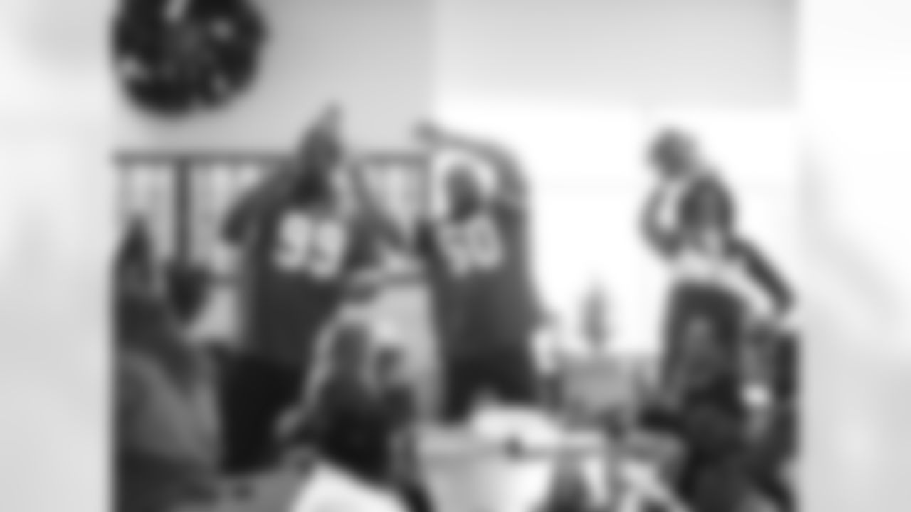 Kansas City Chiefs ambassadors and cheerleaders visit Bosco Senior Center on New Year Eve for a celebration