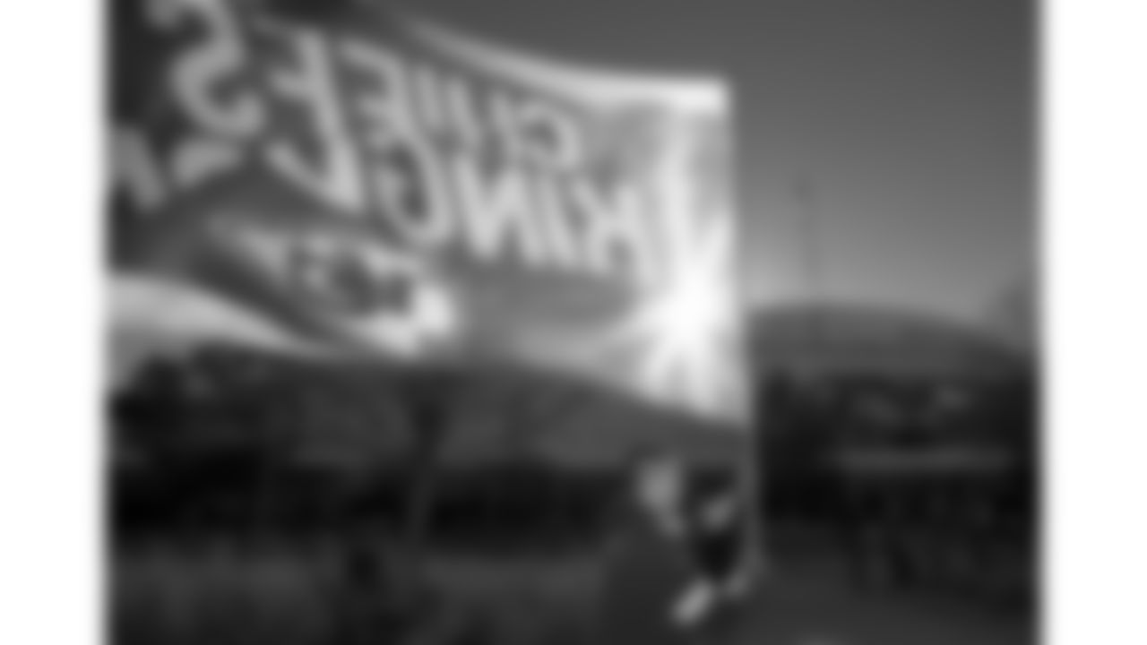A Kansas City Chiefs flag runner prior to an NFL football game against the Las Vegas Raiders, Sunday, December 12, 2021 in Kansas City.