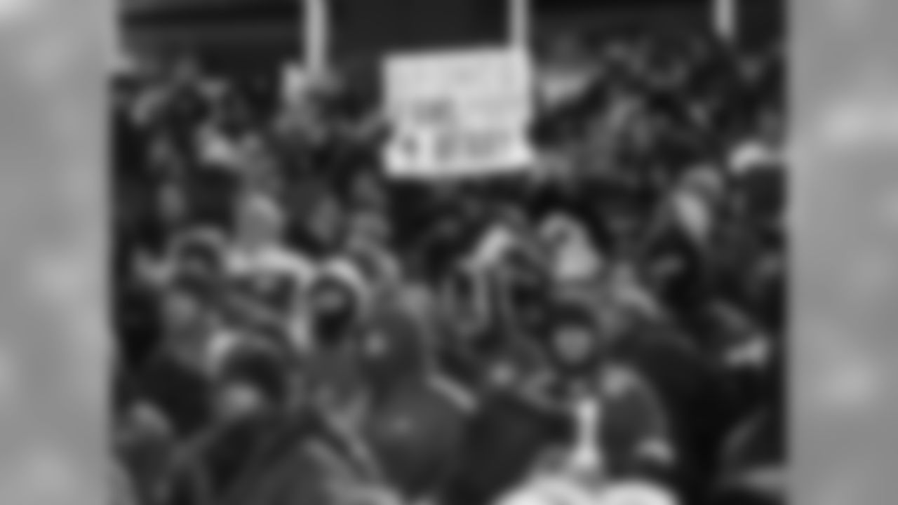 Photos of fans and players showing their support for Safety, Eric Berry