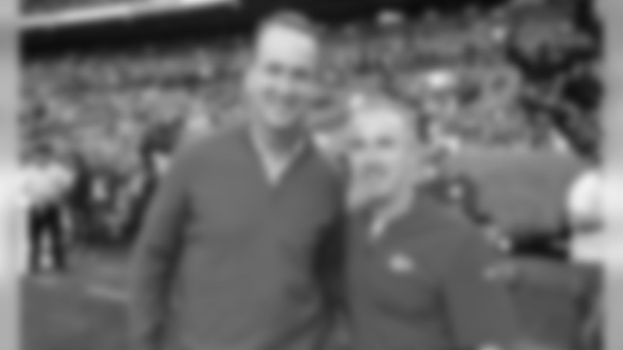 Broncos Alumni Peyton Manning poses for a picture with Kansas City Chiefs Defensive Coordinator Steve Spagnuolo before the game between the game between the Kansas City Chiefs and the Denver Broncos on October 17, 2019 at Empower Field at Mile High.