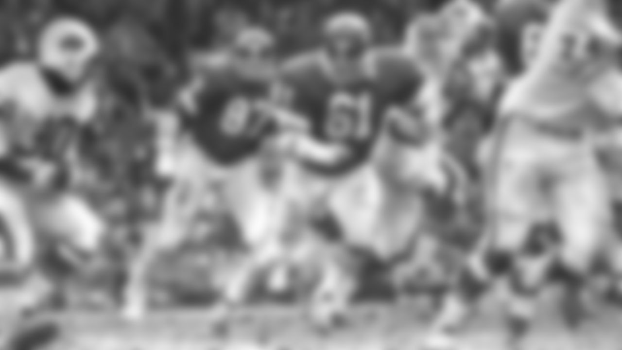 Kansas City Chiefs defensive tackle Curley Culp (61) pursues a Buffalo Bills player during a game in 1971.