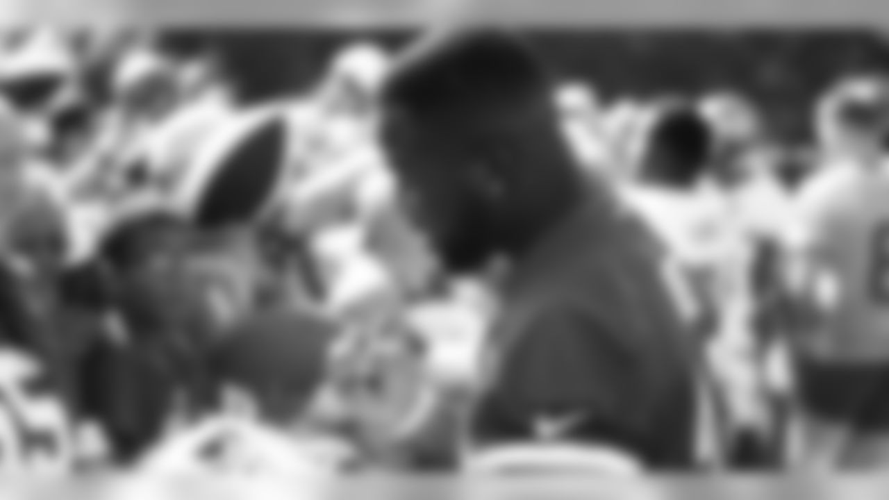 Kansas City Chiefs Running Back Carlos Hyde (34) signs autographs for fans after a 2019 Training Camp practice at Missouri Western State University in St. Joseph, MO.