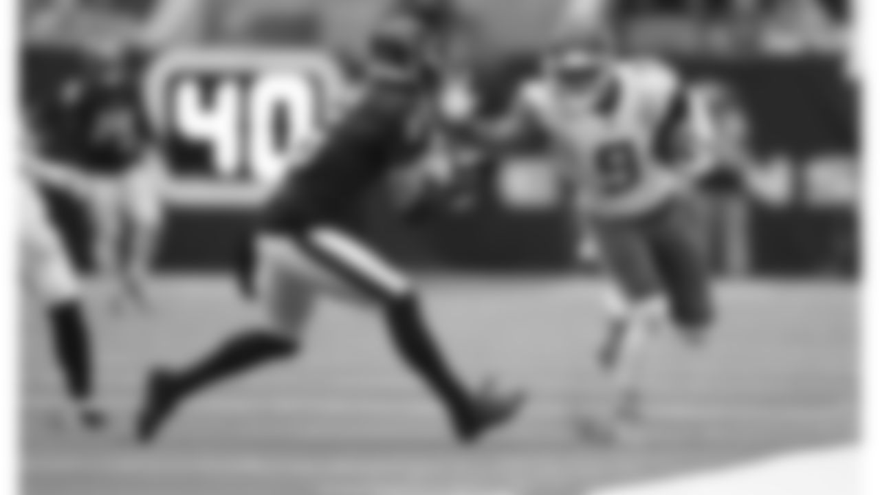 Kansas City Chiefs wide receiver JuJu Smith-Schuster (9) runs after the catch in front of Houston Texans safety Jalen Pitre (5) during an NFL football game, Sunday, Dec. 18, 2022, in Houston.