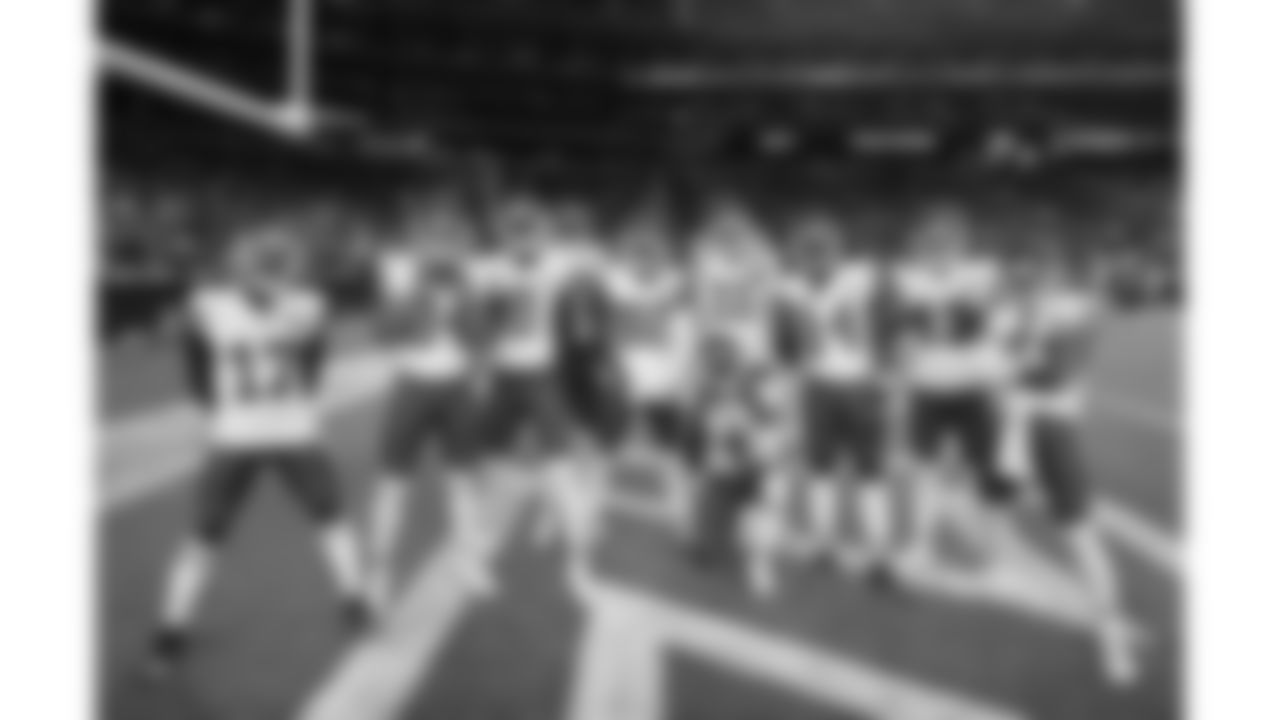 Kansas City Chiefs players during pregame warmups before the Chiefs preseason Week 2 matchup against the Arizona Cardinals on Saturday, August 19, 2023.