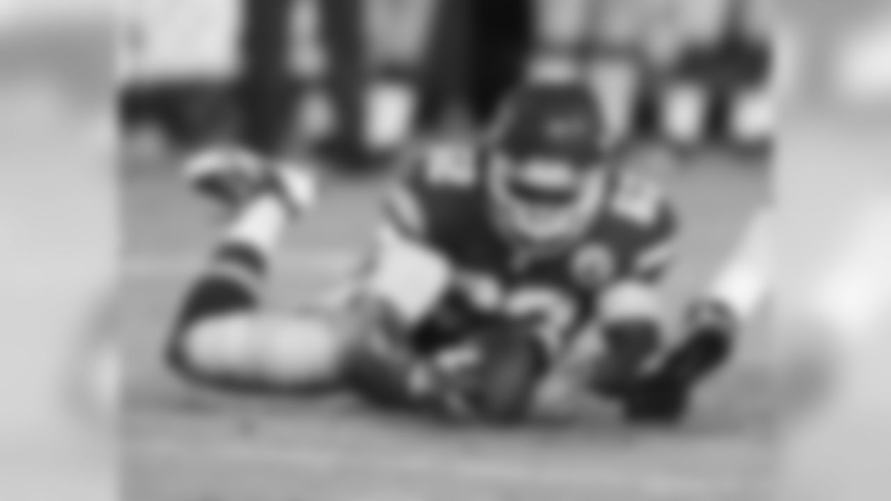 Kansas City Chiefs defensive lineman Josh Martin (62) falls on the football during the 08-29-13 preseason game vs. Green Bay.