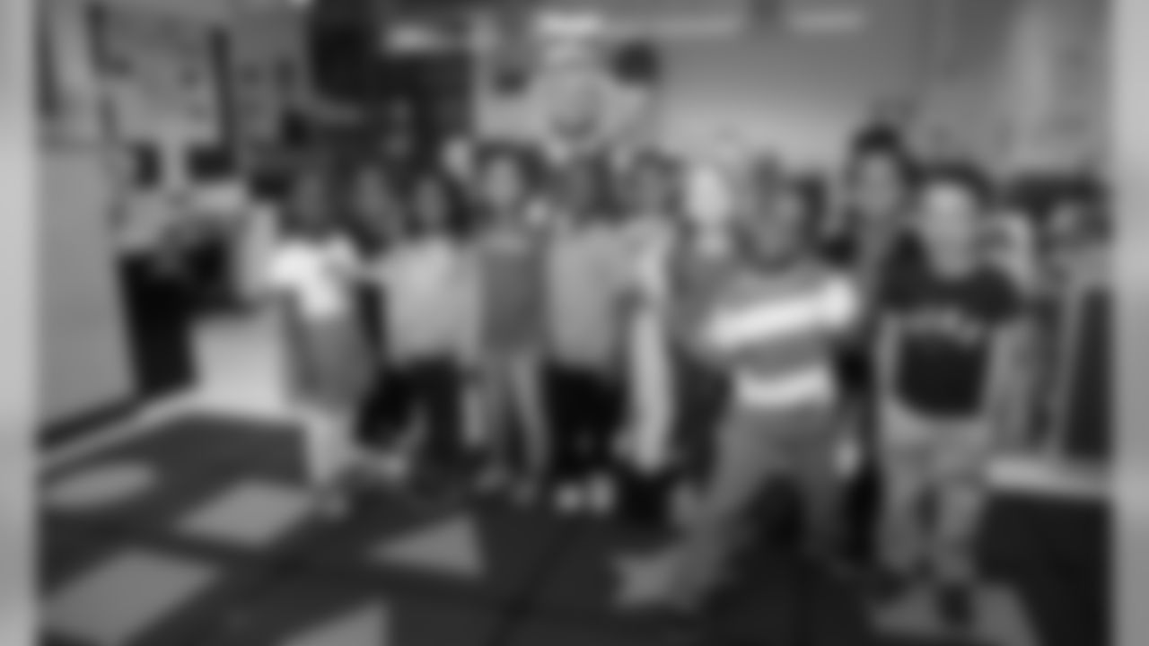 Kansas City Chiefs Punter Dustin Colquitt reads to students at Operation Breakthrough for Read Across America Day on March 2, 2020.