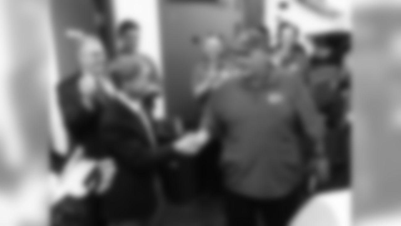 Kansas City Chiefs head coach Andy Reid shakes hands with Kansas City Chiefs Chairman and CEO Clark Hunt during the game against the Jacksonville Jaguars Sunday afternoon on the 8th of September 2013 at EverBank Field. The Kansas City Chiefs defeated the Jaguars 28-2.