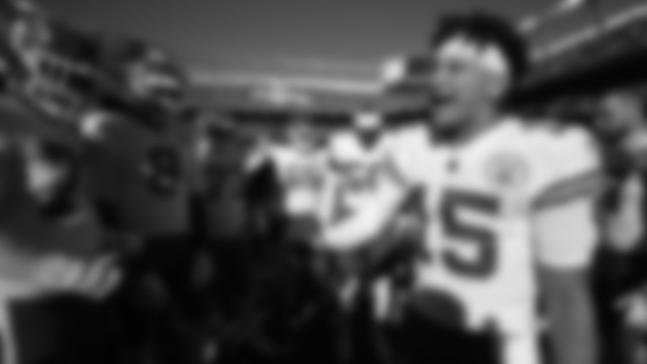 Kansas City Chiefs quarterback Patrick Mahomes (15) leads a team huddle prior to an NFL football game against the Denver Broncos, Sunday, December 11, 2022 in Denver.