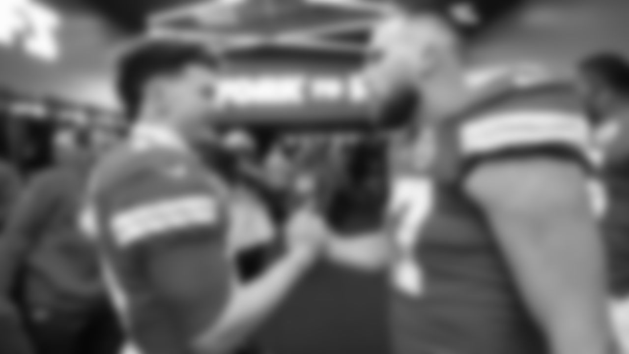 Kansas City Chiefs quarterback Patrick Mahomes (15) and Kansas City Chiefs tight end Travis Kelce (87) congratulate each other in the locker room after the divisional playoff game against the Buffalo Bills, Kansas City, MO on January 23, 2022