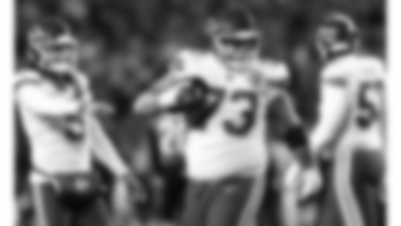 Kansas City Chiefs offensive guard Nick Allegretti (73) celebrates a touchdown by quarterback Patrick Mahomes (15) during an NFL football game against the Cincinnati Bengals, Sunday, December 4, 2022 in Cincinnati.
