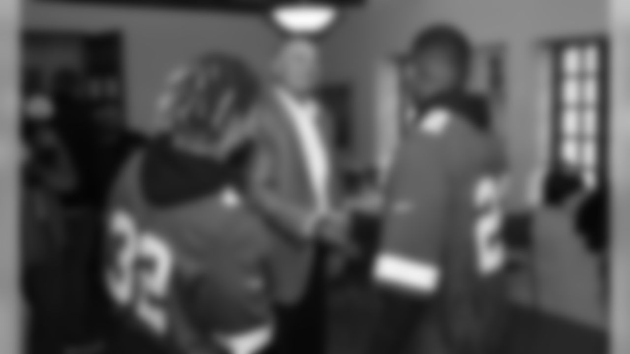 Chiefs players and representatives from KC Southern make a surprise visit to a local family at the Guadalupe Center.