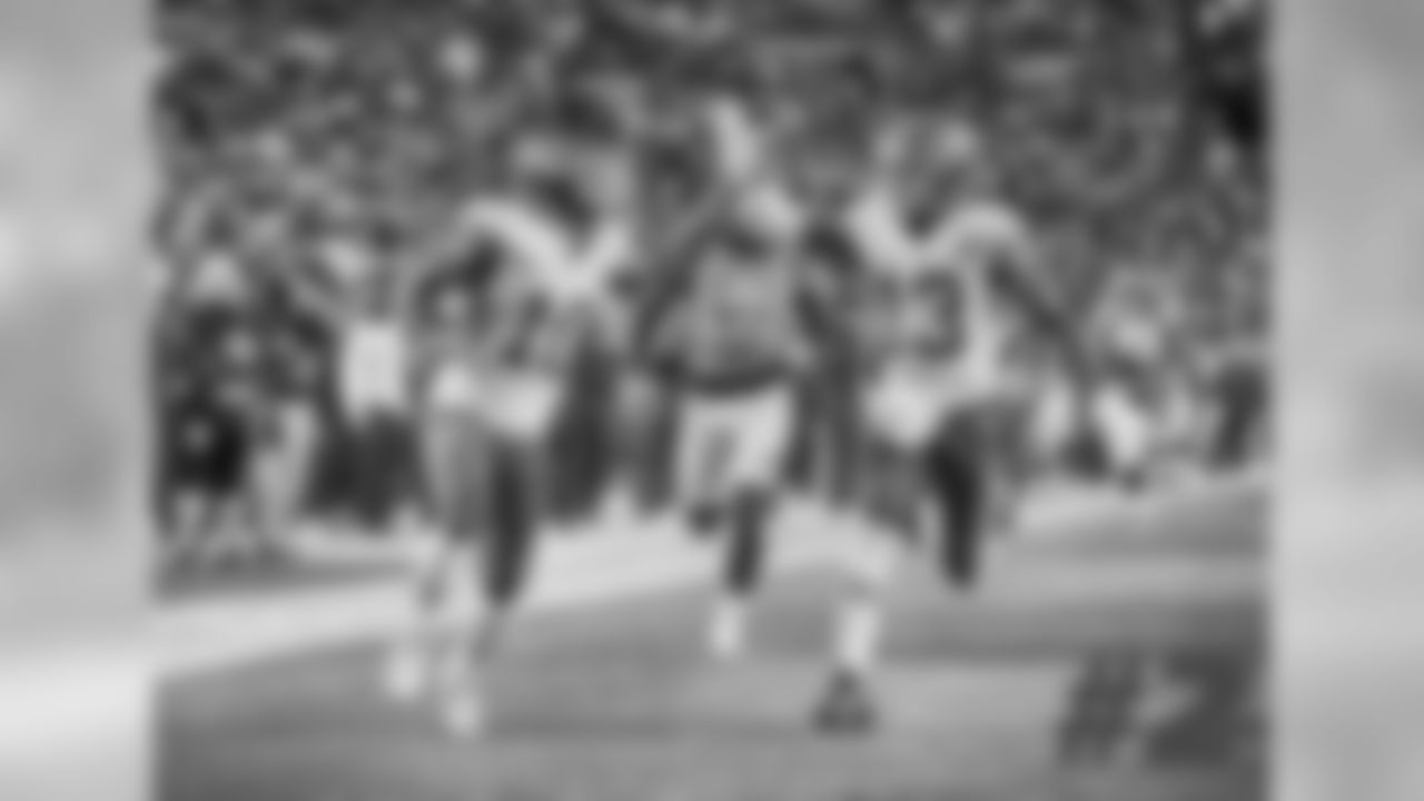 Sanders' comments: "There are so many photographers at a game, and you'll see big plays happen, and a lot of people get a picture from the game that is similar. I believe when this took place, Jim (Berry) was the only photographer in that end zone. "For Tyreek (Hill) and De'Anthony (Thomas) to be running right at him, he's going to be one of the only people that have this angle, which I think is the best angle that anyone could of had of this shot.