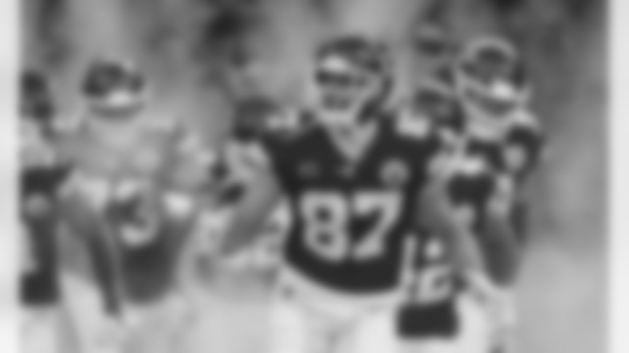 Kansas City Chiefs tight end Travis Kelce (87) yells excitedly while running out of the tunnel during player introductions prior to an NFL Divisional Round Playoff game, Sunday, Jan. 17, 2021 in Kansas City.