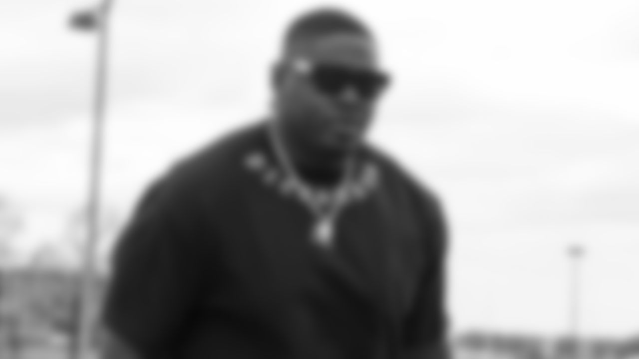 Kansas City Chiefs defensive tackle Jarran Reed (90) arrives at the Kansas City International Airport to travel to Los Angeles for Thursday Night Football against the Chargers.