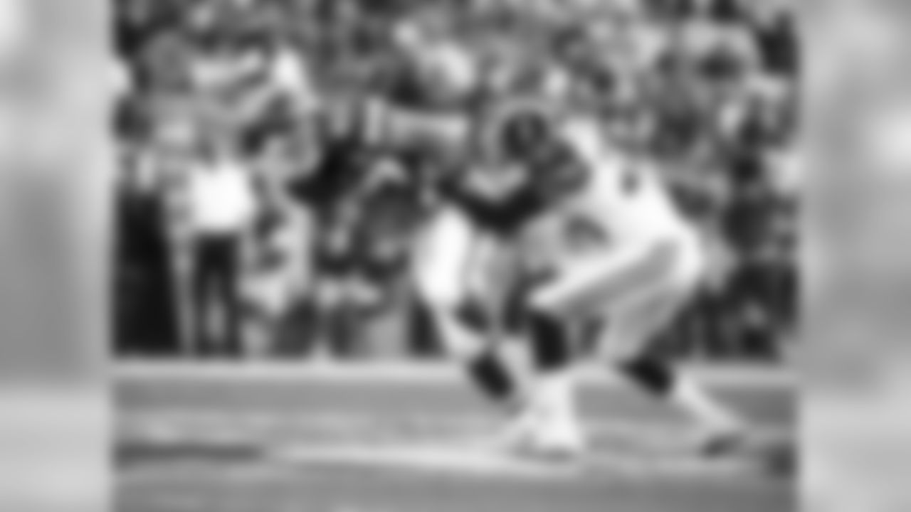 Kansas City Chiefs tight end Travis Kelce (87) is brought down by Los Angeles Rams safety T.J. McDonald (25) during the first half of the preseason game at the Los Angeles Memorial Coliseum on Saturday, August 20, 2016.