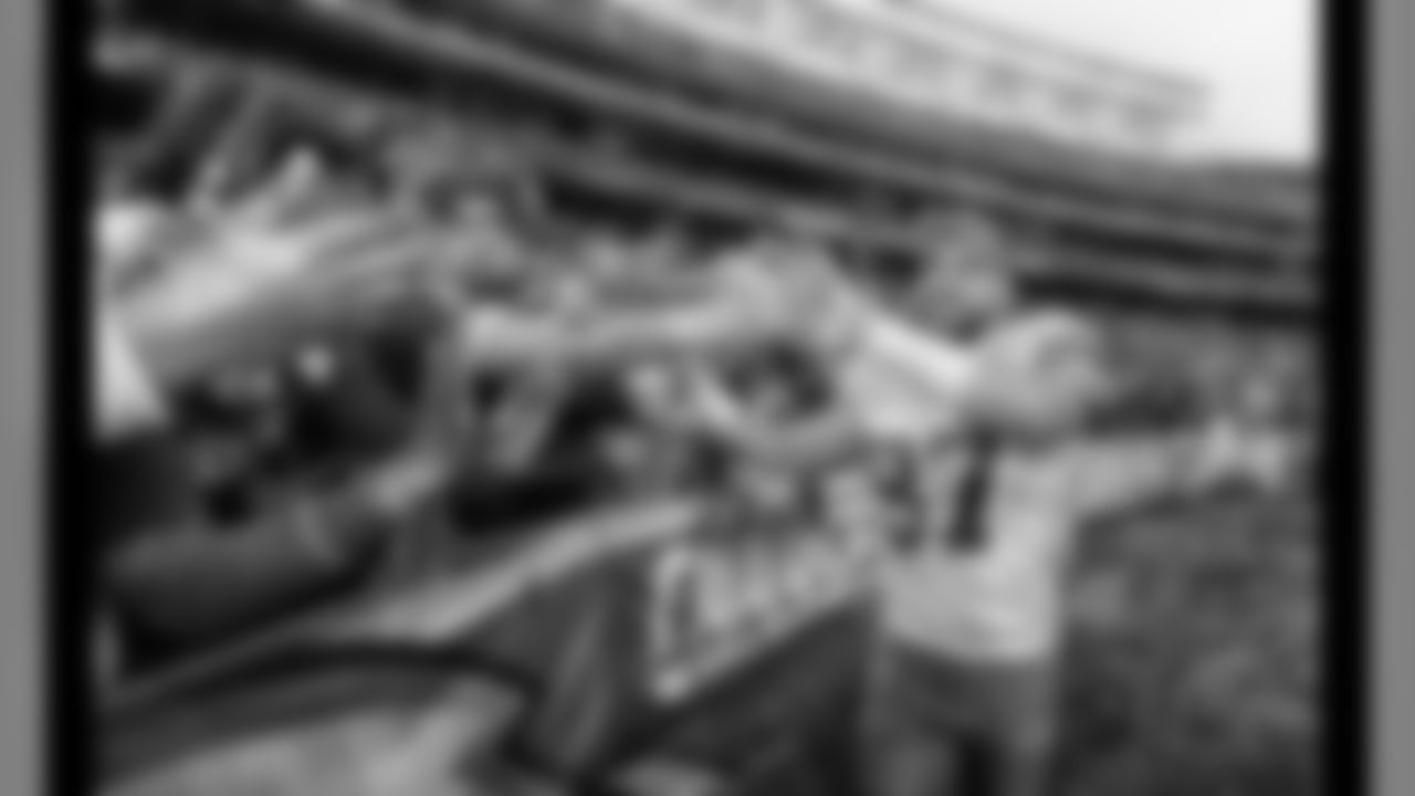 Kansas City Chiefs tight end Travis Kelce (87) high fives fans following the game against the San Diego Chargers, Sunday, January 1, 2017, in San Diego, California.