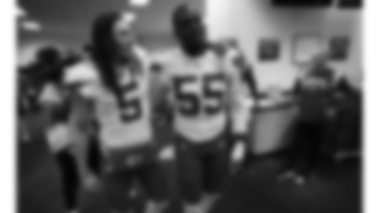 Kansas City Chiefs punter Tommy Townsend (5) and defensive end Frank Clark (55) in the locker room after an NFL football game against the Denver Broncos, Sunday, December 11, 2022 in Denver.