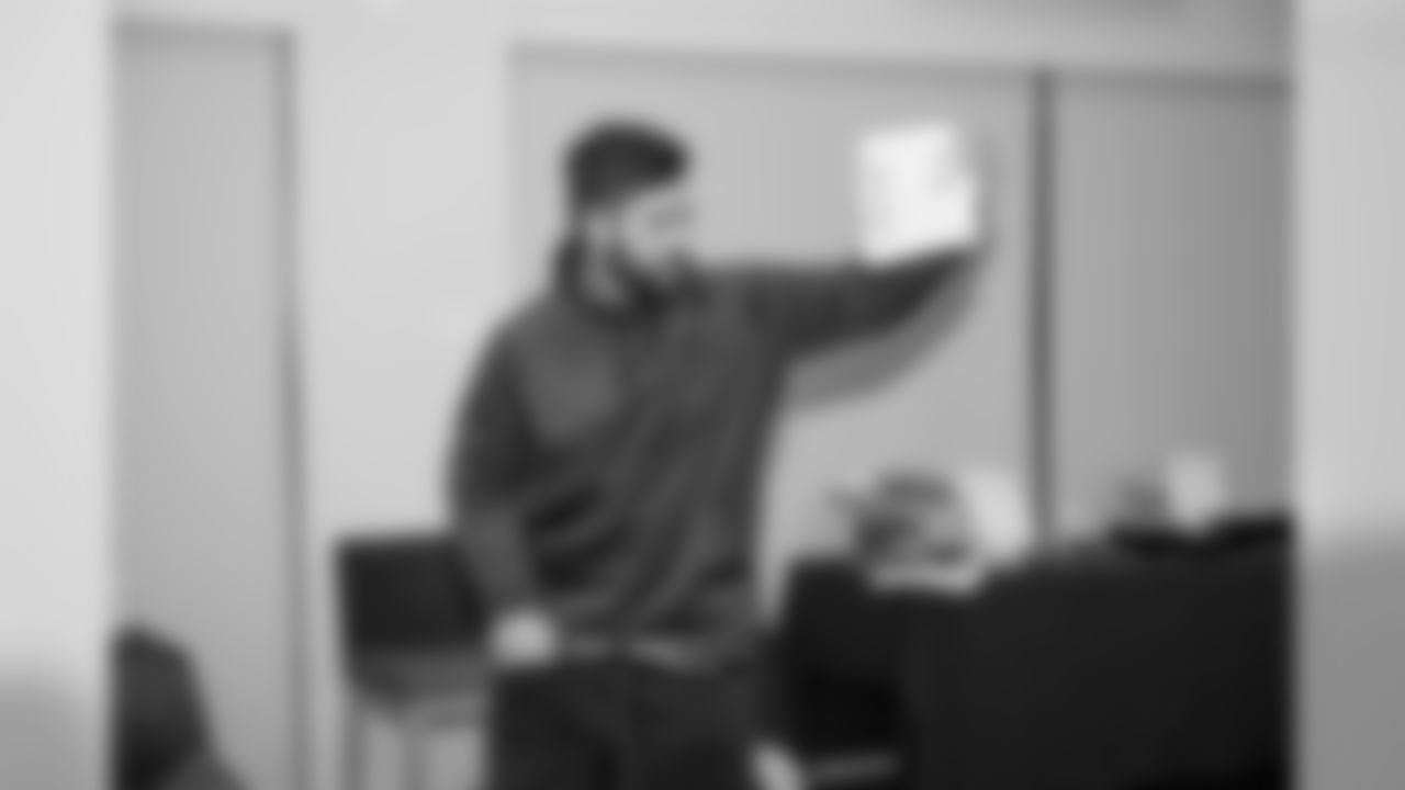 Laurent Duvernay-Tardif, along with the help of his teammates, explains the basics of healthy living and nutrition to a group of 20 young men from BoysGrow on Monday afternoon. The player-led initiative marked the second installment of the players' "4th Quarter Program" which seeks to address social justice areas of particular importance to the players themselves.