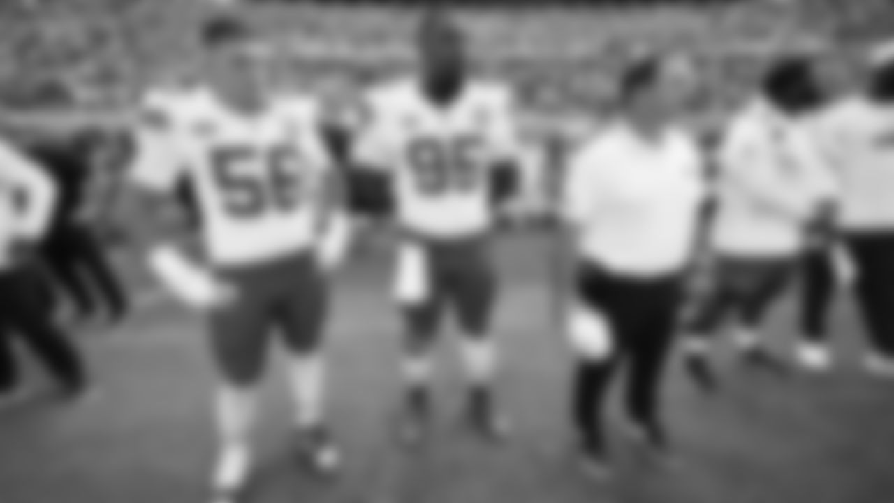 Kansas City Chiefs defensive end George Karlaftis (56), defensive tackle Chris Jones (95), and Defensive Line Coach Joe Cullen prior to the NFL week 2 matchup against the Jacksonville Jaguars at EverBank Stadium in Jacksonville, Florida on September 17, 2023.