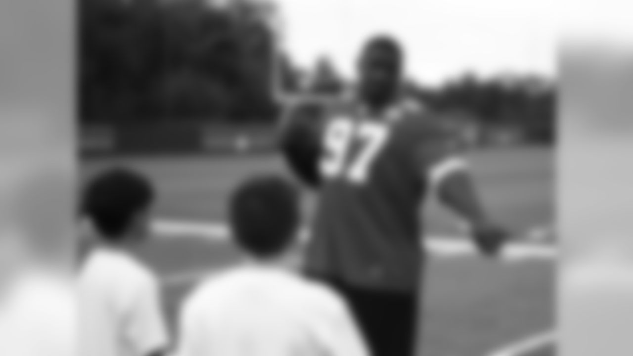 Dontari Poe and Allen Bailey help the Chiefs host the Play 60 Character Event with the Guadalupe Center on September 23, 2014 at the University of Kansas Training Facility