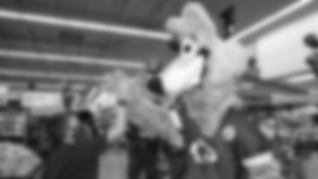 Kansas City Chiefs representatives help with the official kickoff event of the 2021 Playoffs at Hy-Vee on Monday, January 10, 2021 in Overland Park.