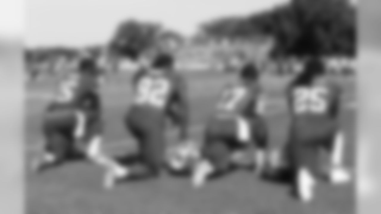 WR A.J. Jenkins, WR Dwayne Bowe, WR Donnie Avery, and RB Jamaal Charles taking a break on the sidelines.