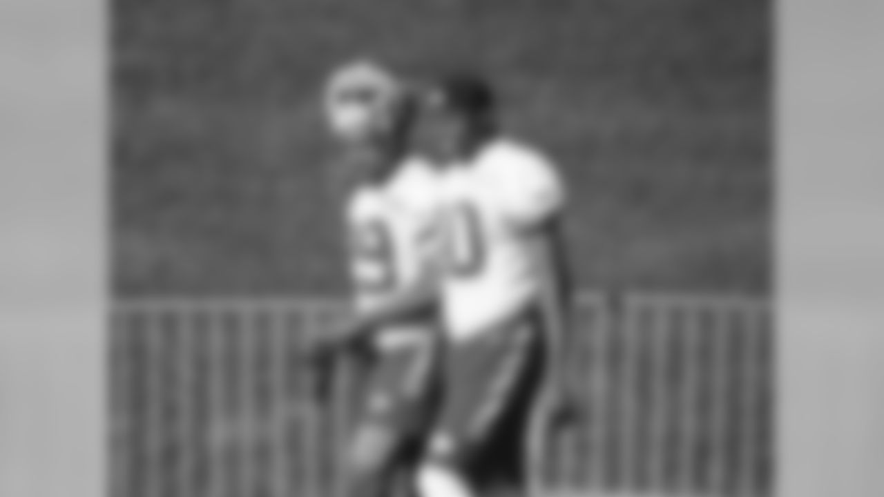 Kansas City Chiefs defensive back Eric Berry (29) and defensive back Deji Olatoye (40) walk out to the field.