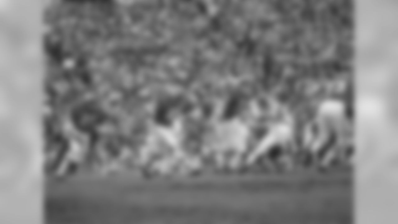 Kansas City Chiefs quarterback Len Dawson prepares to handoff to running back Mike Garrett (21) as running back Robert Holmes (45) and guard Ed Budde (71) lead the play during the Super Bowl in New Orleans on Jan. 11, 1970.