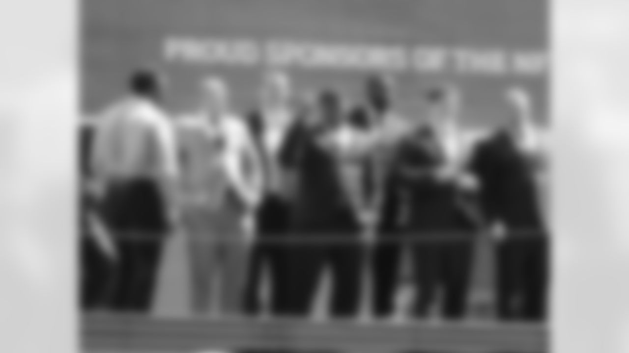 The 2013 NFL Draft invitees stand atop the marquee at Radio City Music Hall on April 24, 2013 in New York, NY.