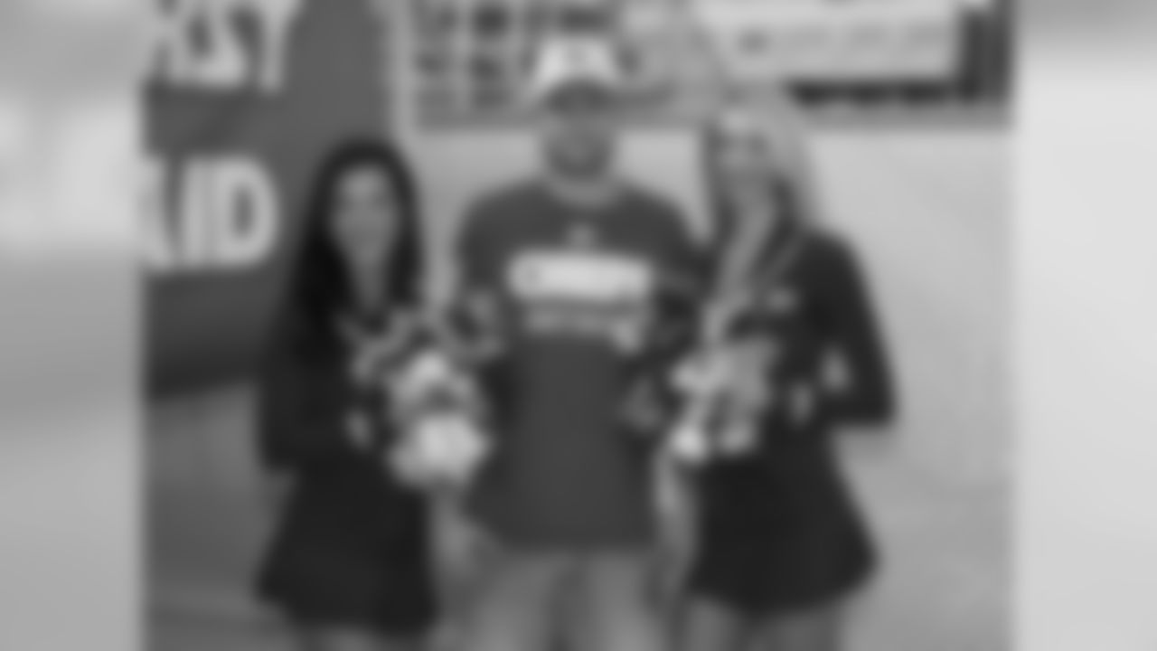 Fans get their photo taken with Chiefs Cheerleaders during practice on 8/4/18 at Chiefs Training Camp at Missouri Western State University in St. Joseph, Missouri.