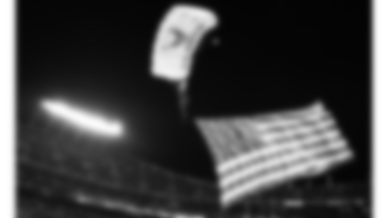 Wings of Blue parachute team prior to an NFL football game against the New York Giants, Monday, November 1, 2021 in Kansas City.