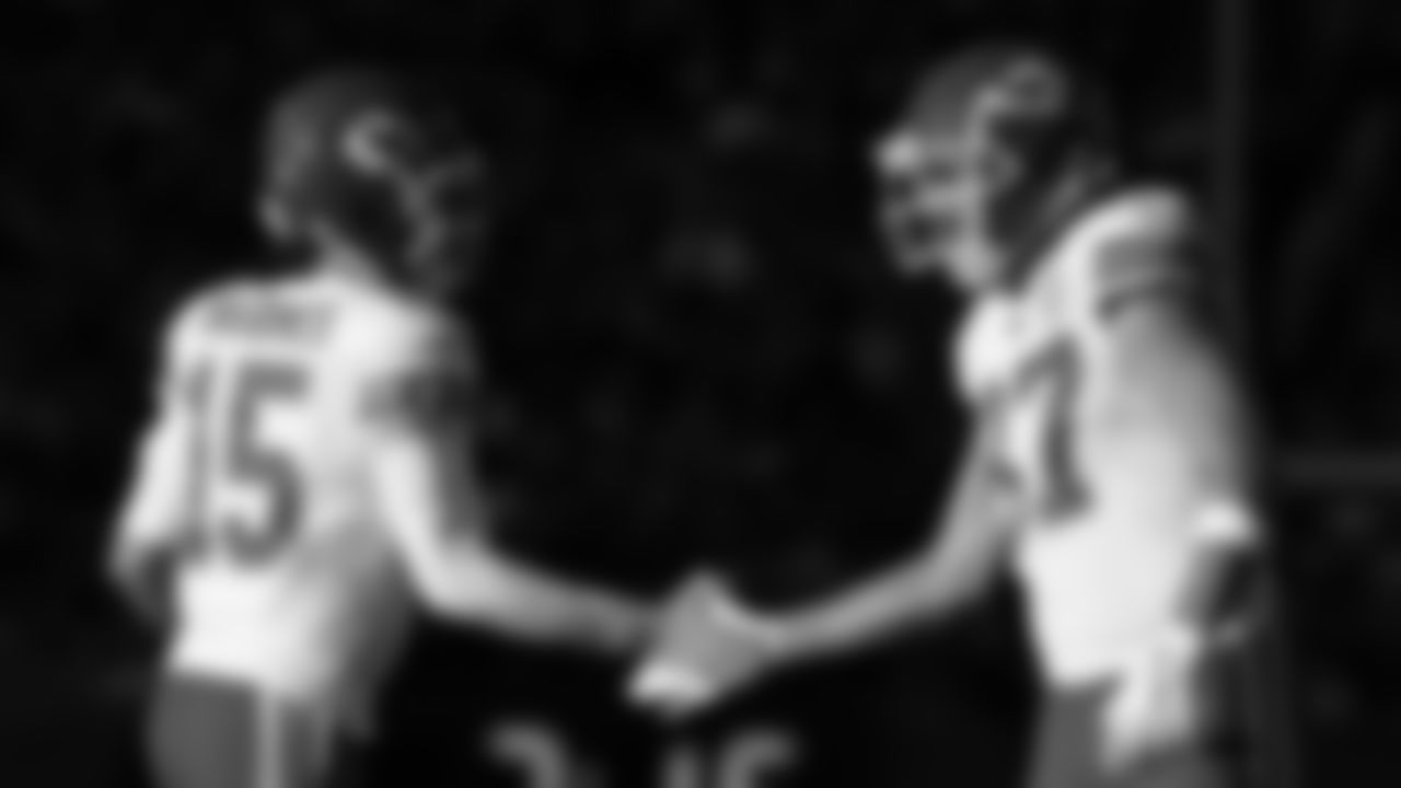 Kansas City Chiefs quarterback Patrick Mahomes (15) and tight end Travis Kelce (87) slap hands during an NFL football game against the Denver Broncos, Sunday December 11, 2022