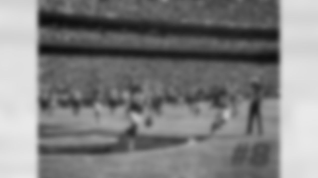 Sanders' comments: "This was roughly around a 50-yard pick-six, and it was a ball that was tipped from Eric Berry and [Dan Sorensen] ran across through the play and was able to navigate his way through the entire Saints offense to come back through, and I happened to be in the end zone watching the play and pulled out a wider lens, so you could get the whole Sea of Red behind him with the stadium and him coming through.