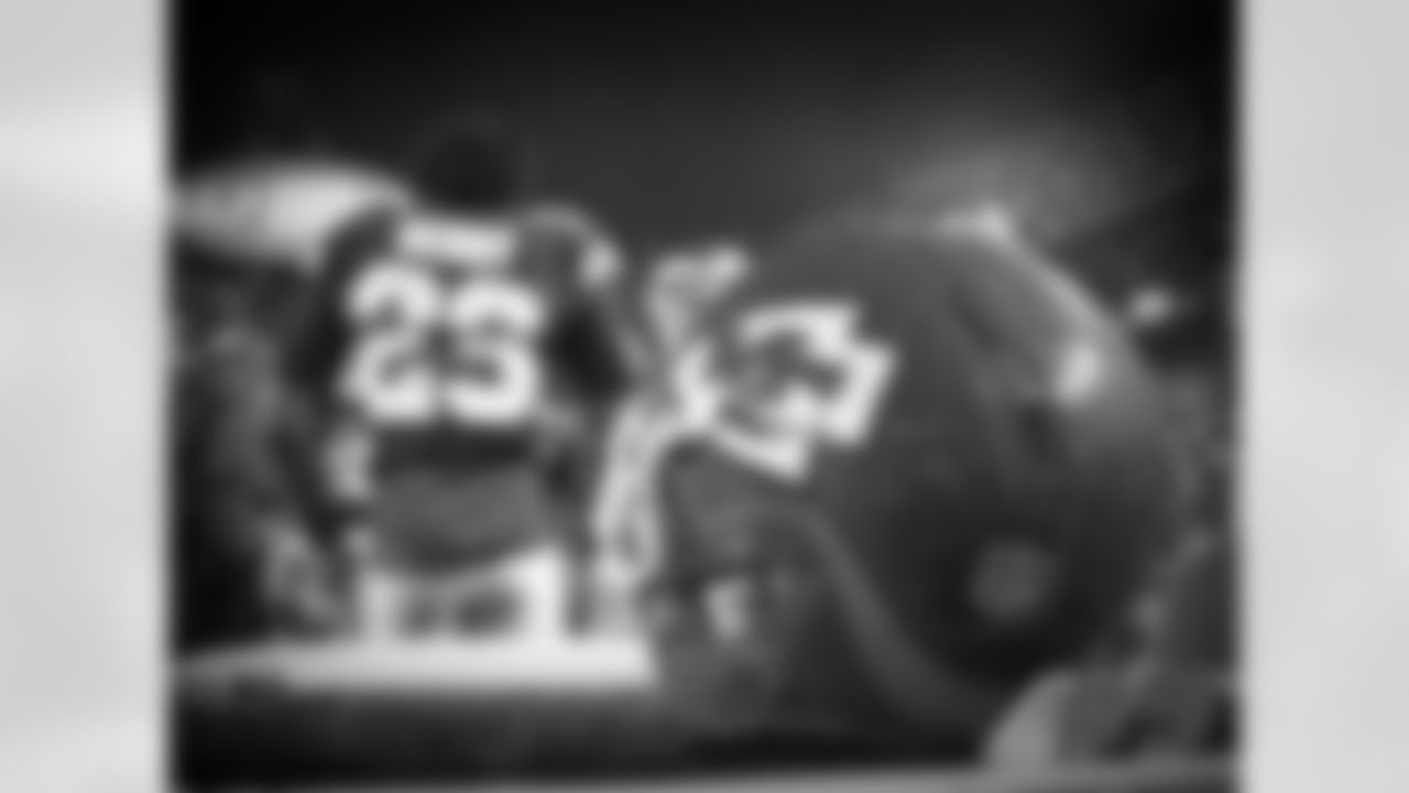Sanders' comments: "Eric Berry came over and sat his helmet on the Gatorade stand. It's got the texture, the rain and the grass, so you can just tell by the way his helmet looks that he's been on the ground. And he just kind of walked away and stood in front of it, and it just kind of set itself to have some real depth and I kind of thought about what's going on, what's going through his mind. He's watching the scoreboard and talking to his teammates, so this was neat with the texture, the bumpiness of the Gatorade table and the raindrops.