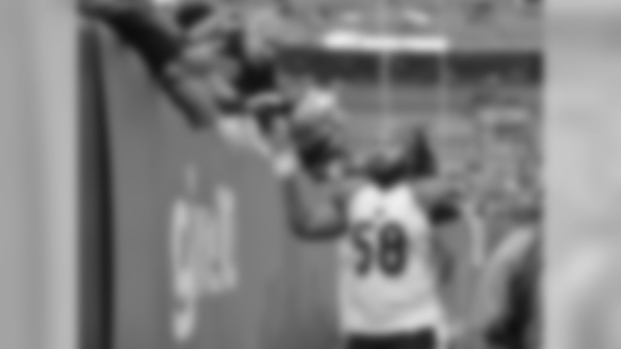 Cincinnati Bengals middle linebacker Rey Maualuga (58) celebrates with fans after a 30-0 win over the Cleveland Browns in an NFL football game Sunday, Dec. 14, 2014, in Cleveland.